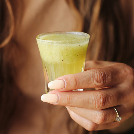 Green Apple Ginger Wellness Shot with fresh apple, cucumber, lemon, and ginger